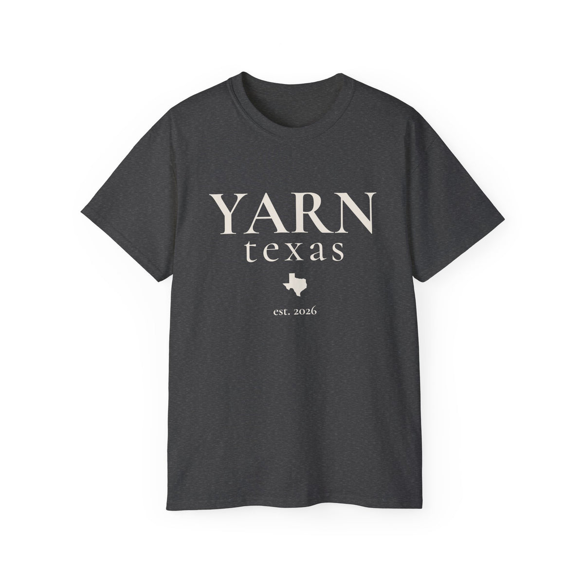 A dark heathered gray short-sleeve crewneck t-shirt with 'YARN texas est. 2026' printed in black on the front, displayed against a solid white background.