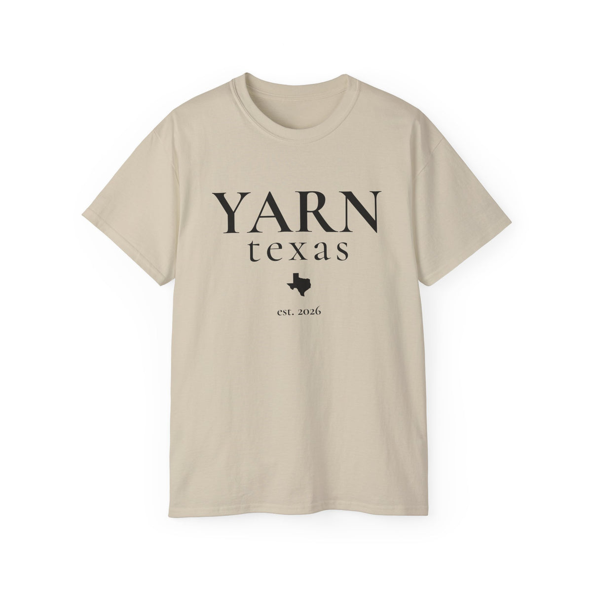 A beige short-sleeve crewneck t-shirt with a black graphic print reading 'YARN texas est. 2026' and a Texas state silhouette, displayed on a clean white background.