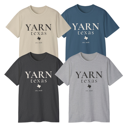 Four short-sleeve crewneck T-shirts arranged in a 2x2 grid on a white background, each with the text 'YARN texas' and a small Texas-shaped logo printed on the chest. The shirts are in beige, blue, charcoal gray, and light gray.